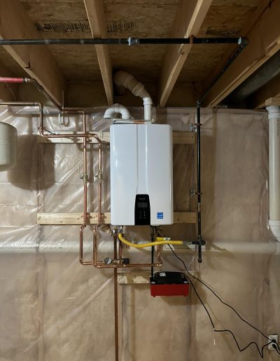 Navien on deman water heater installed in a basement