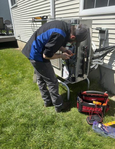 Brock service tech servicing a mini split