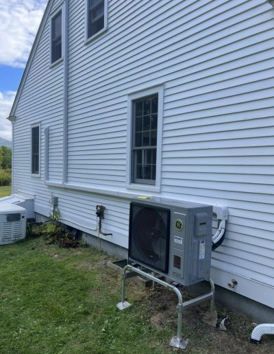 heat pump installed on the outside of a home