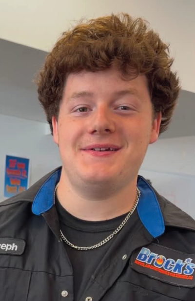 Joe Brock in a Black Brock's button up work shirt