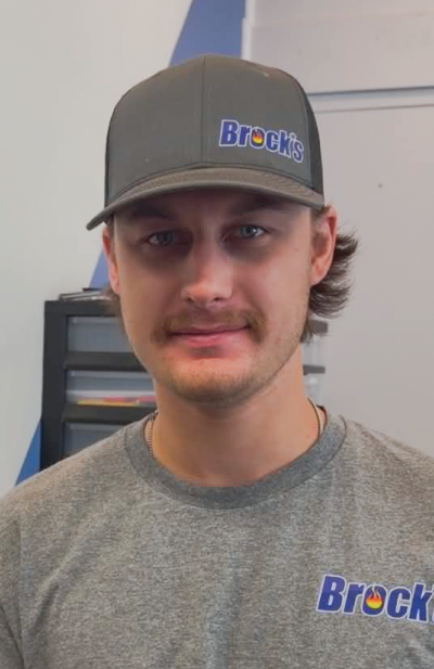 Noah Brock in a Brock's hat and gray shirt